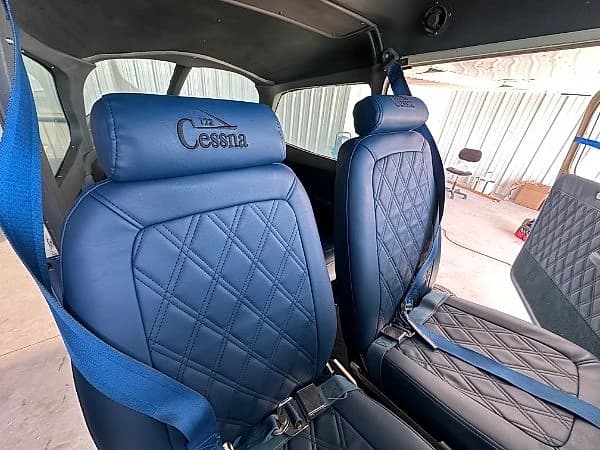 Blue diamond-stitched Cessna aircraft seats upholstered by GVO Classic Upholstery