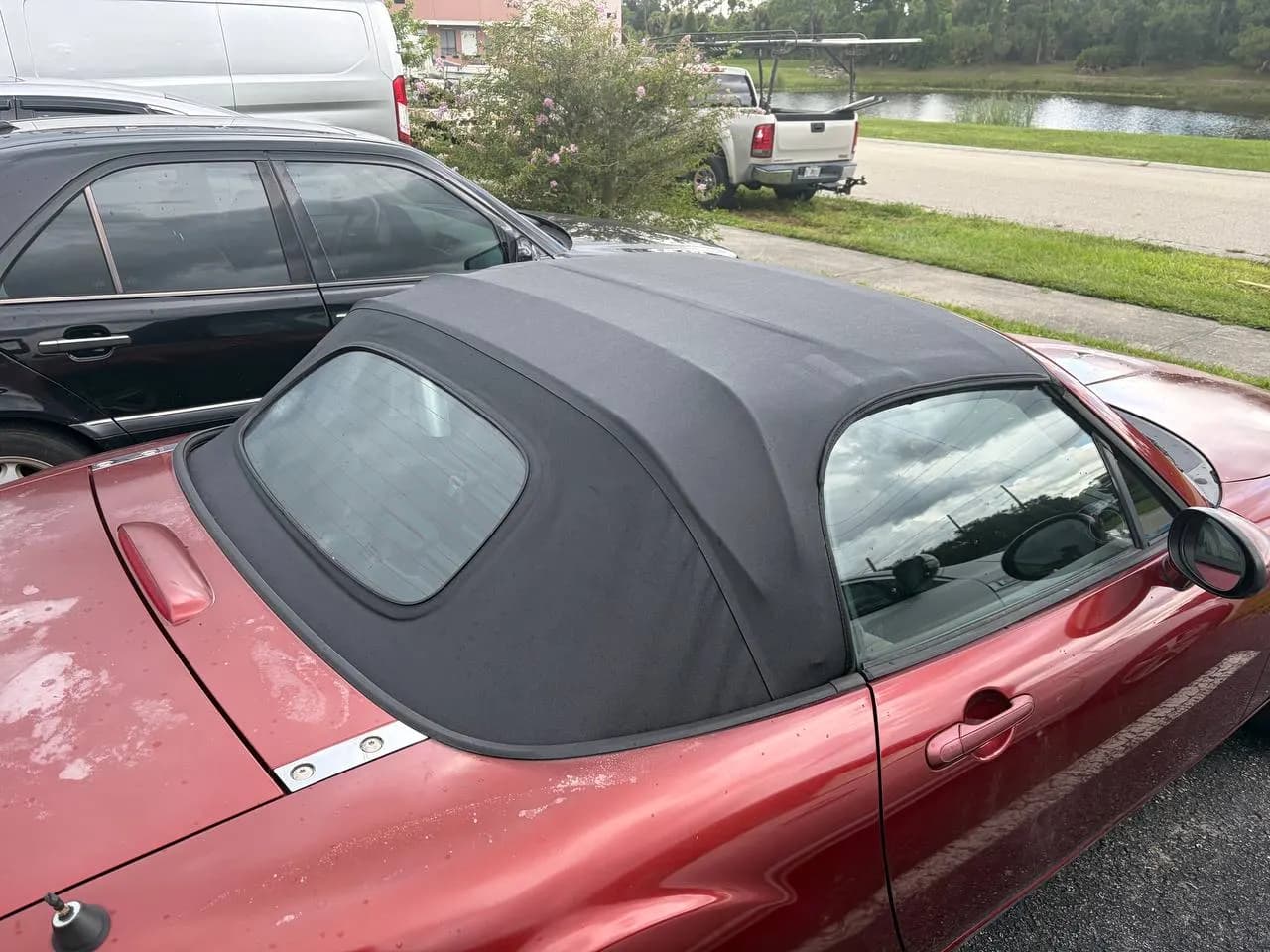 New black cloth convertible top with glass rear window installed by GVO Classic Upholstery
