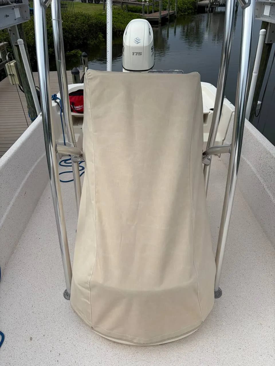 Custom canvas leaning post and helm seat cover on a center console boat